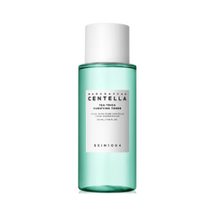 Lys grøn flaske med hvidt låg og etiket. Tekst: SKIN1004, Madagascar Centella, Tea-Trica Toner.