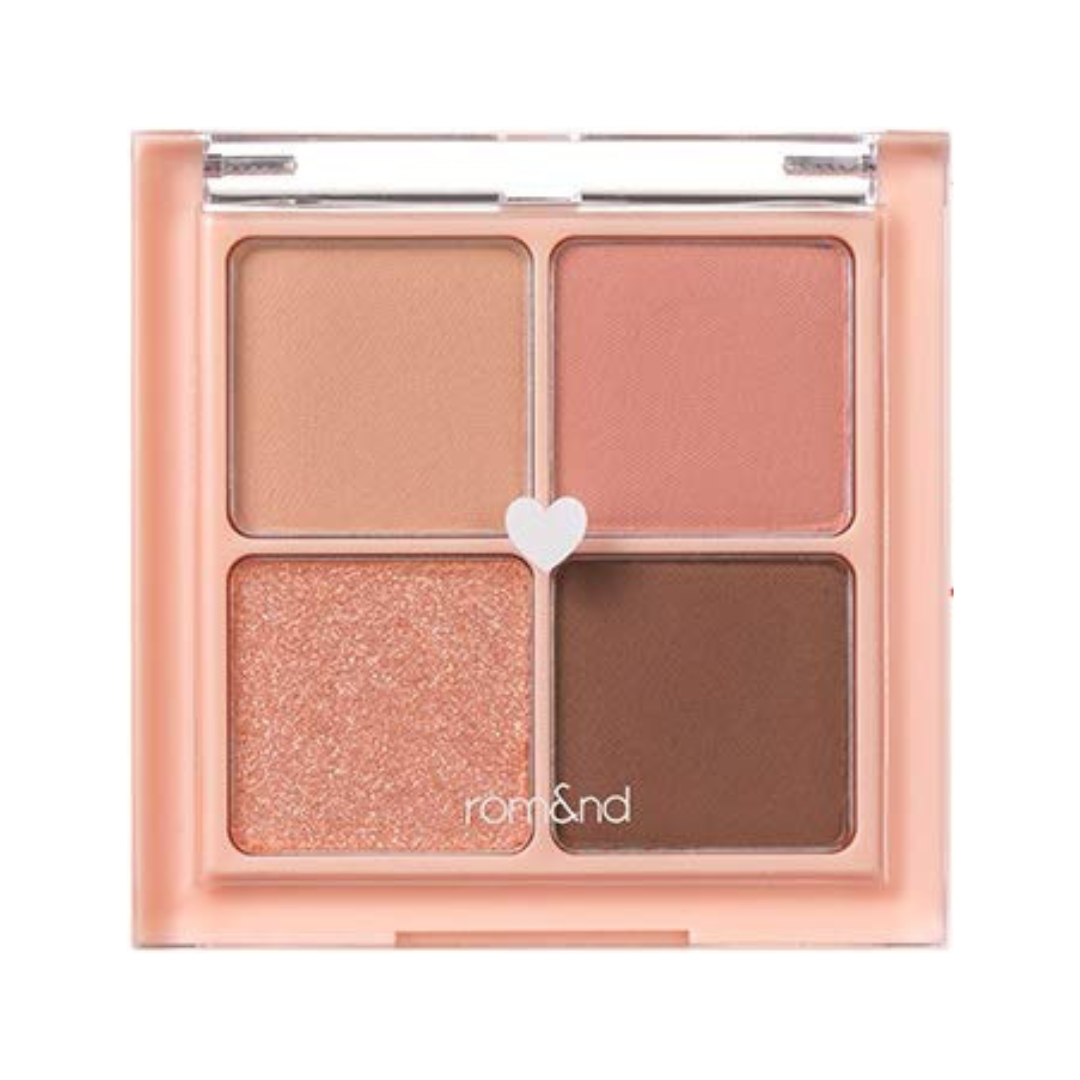 Øjenskyggepalette med fire nuancer: lys fersken, pink, glitrende fersken og brun.