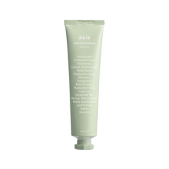 Lysegrøn tube med hvid tekst, der viser ingredienser til Abib Heartleaf Crème Calming Tube.