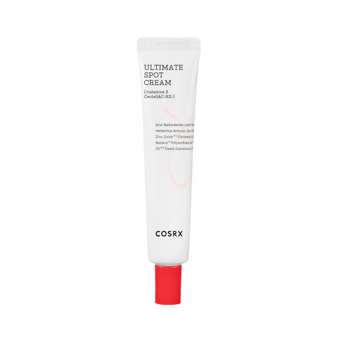 Hvid tube med rød hætte, mærket "Ultimate Spot Cream" fra Cosrx.