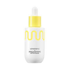 Hvid flaske med gul bølge og pipette, teksten "Vitamin C Brightening Ampoule."