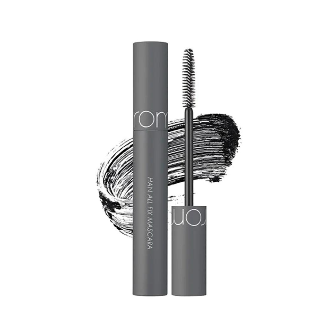 Grå mascara med børste og sort strøg bagved, mærket "Han All Fix Mascara".