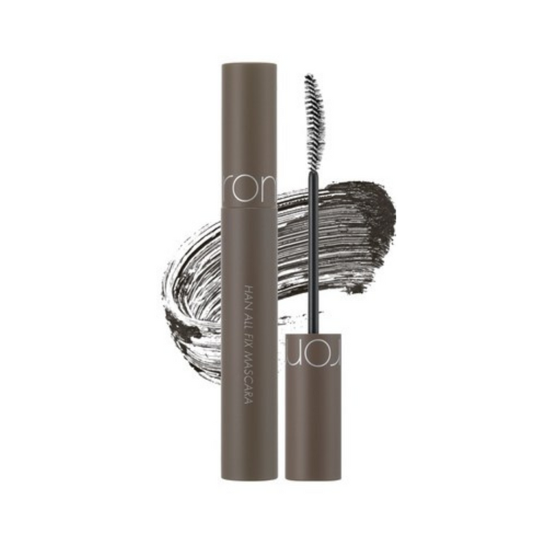 Brun mascara med børste og sort strøg i baggrunden. Tekst på tuben: "Han All Fix Mascara".