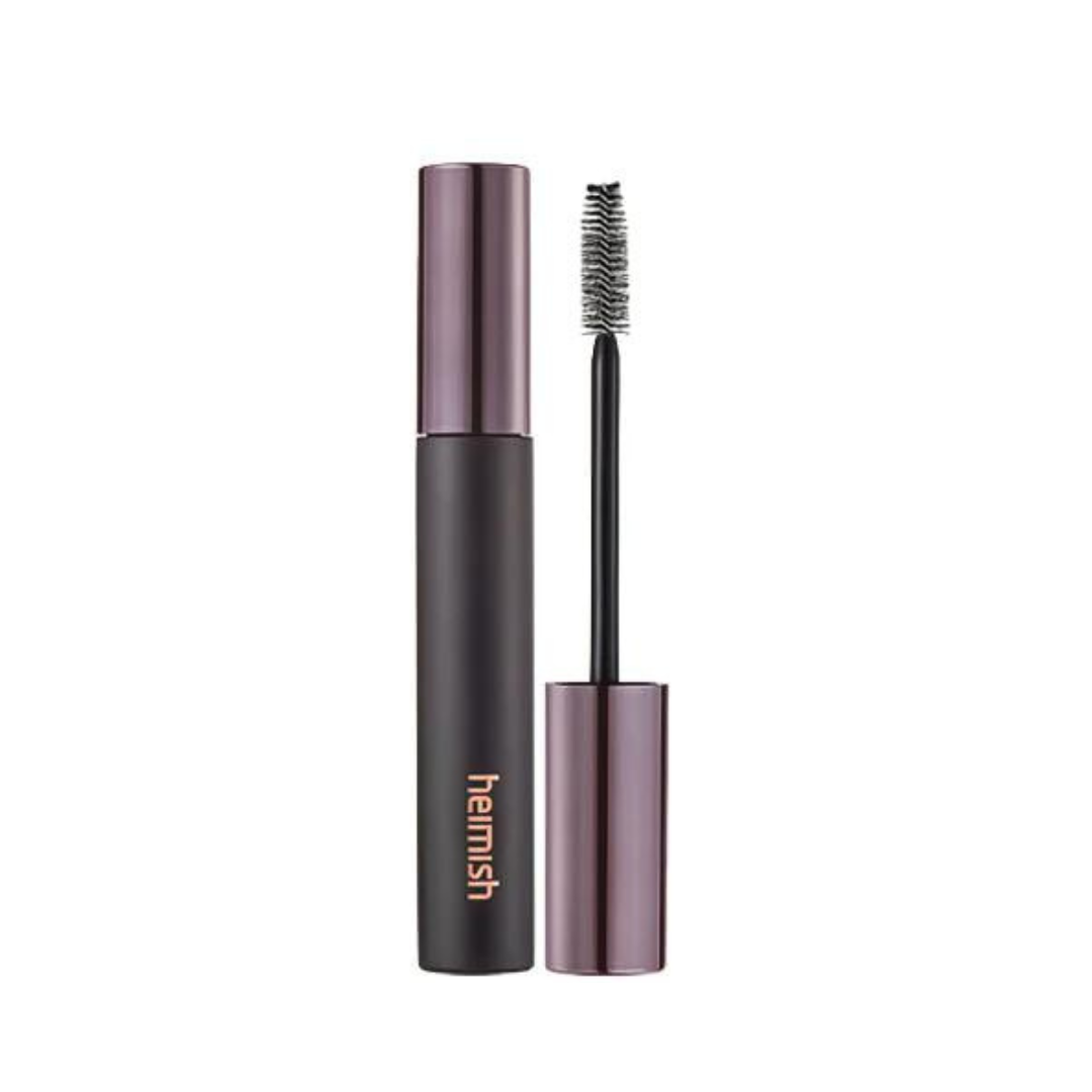Heimish mascara med sort tube, metallic låg og orange logo. Børstehovedet er synligt.