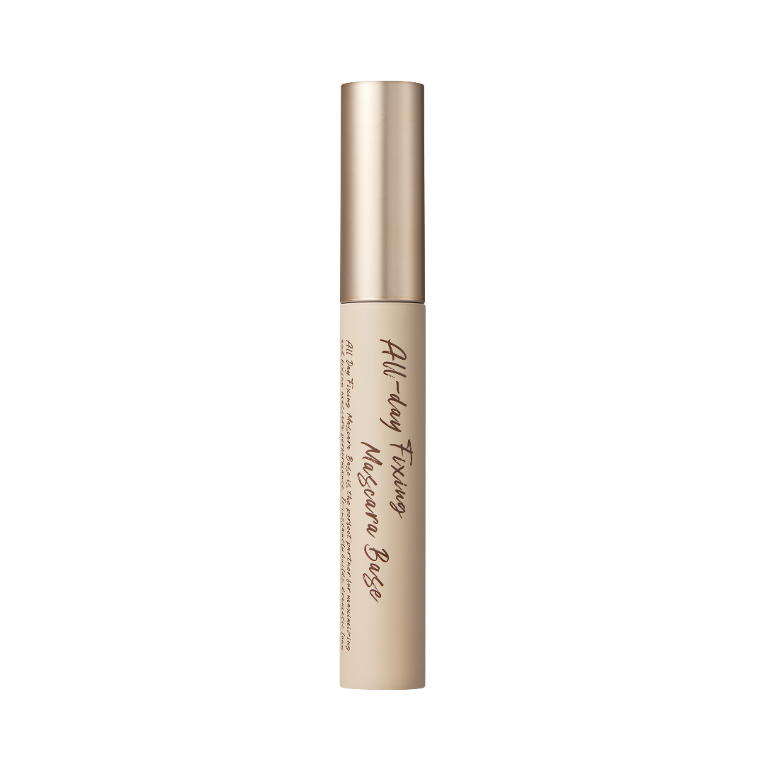 Beige tube med guldhætte, teksten "All Day Fixing Mascara Base" står på siden.
