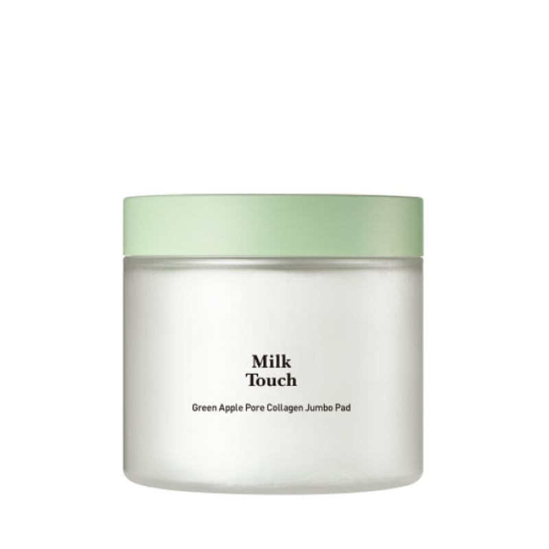 Hvid krukke med lysegrønt låg, etikette med teksten "Milk Touch Green Apple Pore Collagen Jumbo Pad".