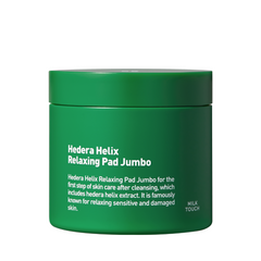 Grøn beholder med teksten "Hedera Helix Relaxing Pad Jumbo" og beskrivelsen af produktets anvendelse.