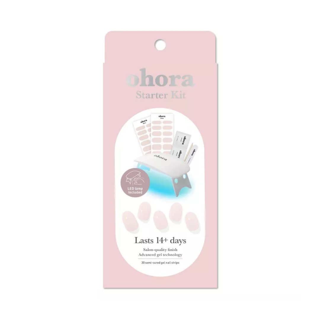 Pink pakke med Ohora Starter Kit, LED-lampe, neglestrimler, og tekst "Lasts 14+ days".