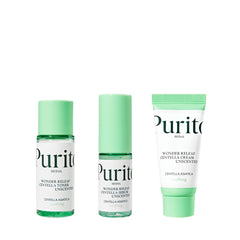 Tre Purito produkter: toner, serum og creme, med grønne hætter og hvide etiketter.