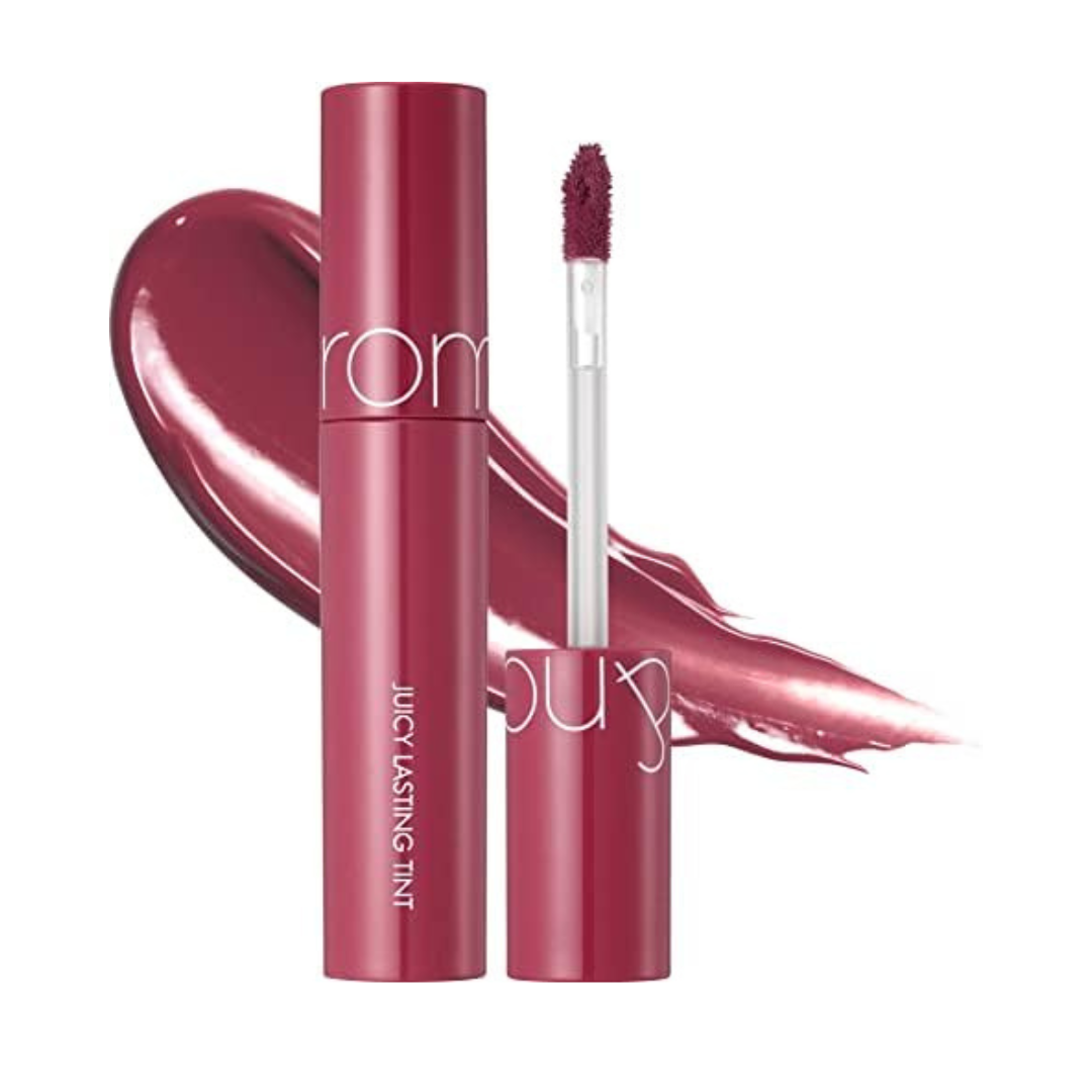 Rom&nd Juicy Lasting Tint i farven FigFig, med en rig, figfarvet nuance og applikatorbørste.