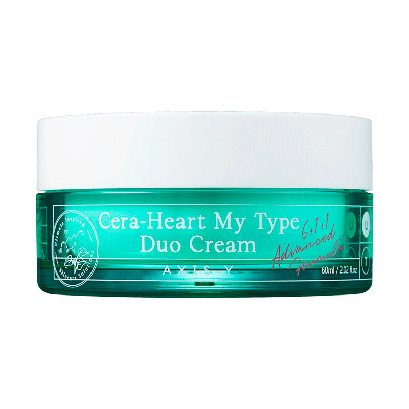 Turquoise krukke med hvidt låg, mærket "Cera-Heart My Type Duo Cream" fra Axis-Y.