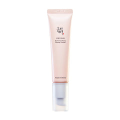 Beige tube med sort tekst: "Revive Eye Serum Ginseng + Retinal". Klar hætte, elegant design.