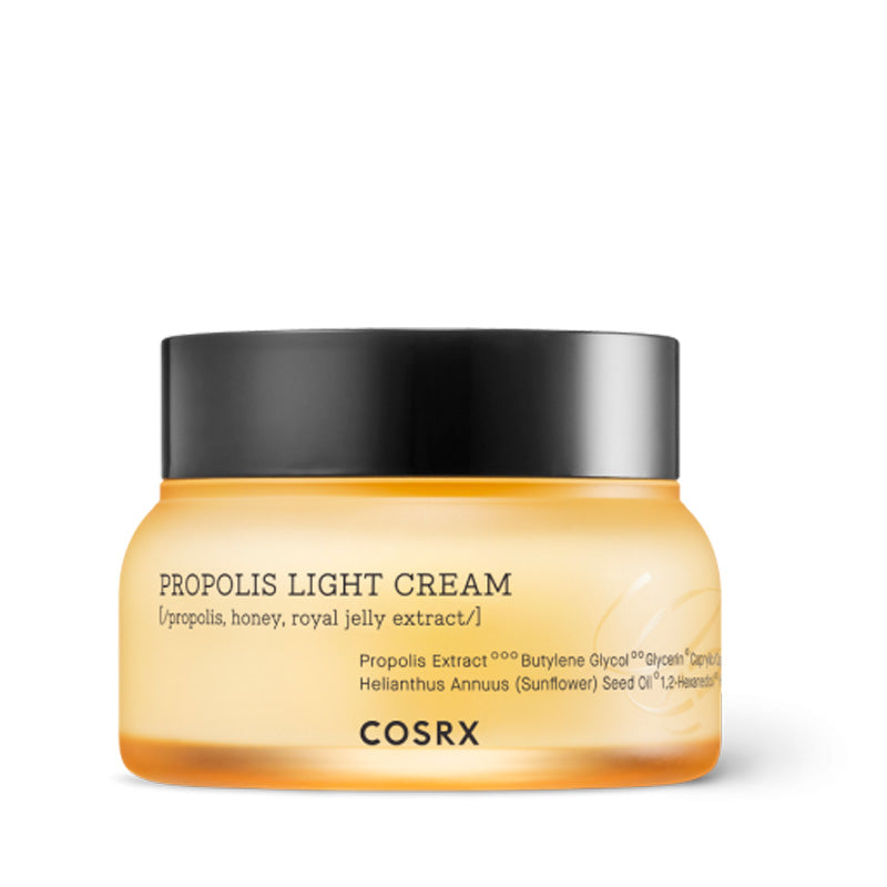 Gul krukke med sort låg, tekst "Propolis Light Cream" og mærket "COSRX" på forsiden.
