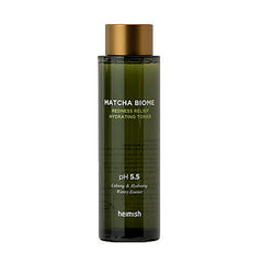 Grøn flaske med guldlåg, mærket "Heimish Matcha Biome Redness Relief Hydrating Toner".