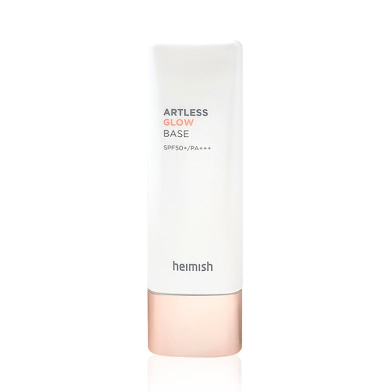 Hvid flaske med tekst "Artless Glow Base SPF50+ PA+++" og rosaguld hætte.
