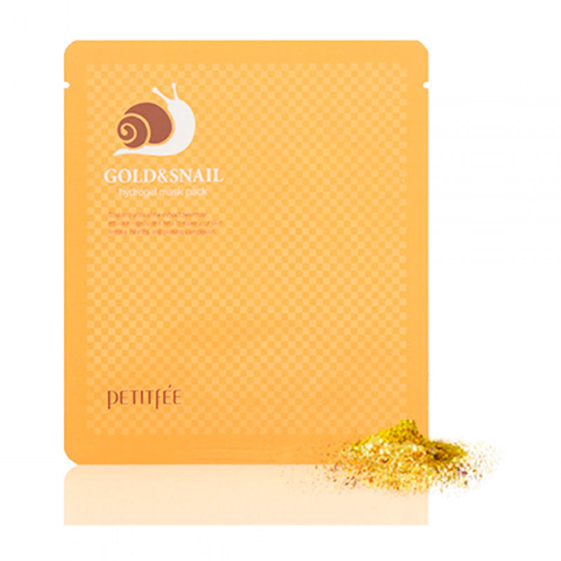 Orange pakke med sneglelogo og tekst "Gold & Snail Hydrogel Mask Pack", guldpulver ved siden af.