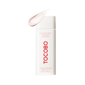 Hvid flaske med "TOCOBO", pink solcreme ovenpå, SPF50+ PA++++, 50 ml.