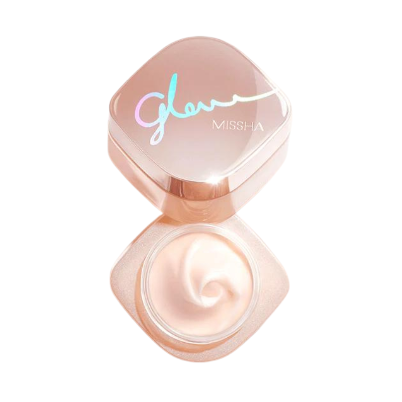 Åben beholder med Missha Glow Skin Balm, glat creme med swirl og pink låg med iriserende tekst.