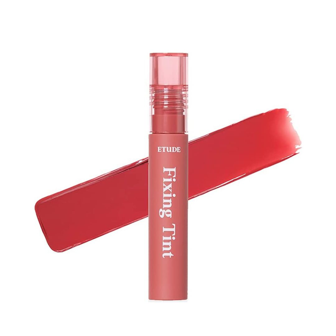 Pink tube med hvid tekst "Fixing Tint", rosefarvet swatch bagved.