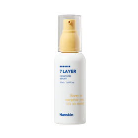 Hvid flaske med gul pumpe, blå tekst "7 Layer Ceramide Serum", 50ml. Hanskin-mærket nederst.