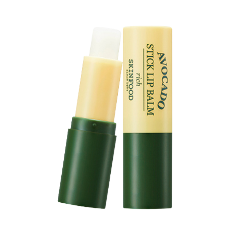 Grøn og gul tube med åben, hvid Skinfood Avocado Stick Lip Balm.