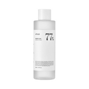 Klar flaske med Anua Heartleaf 77% Soothing Toner, enkel etiket og hvidt låg.