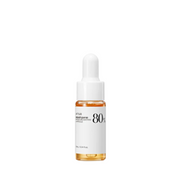 Flaske med hvidt label og dråber. "Anua Heartleaf 80% Moisture Soothing Ampoule, 10 ml."