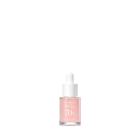 Lille glasflaske med hvid pipette, indeholder lyserød serum. Tekst: Anua Peach 70 Niacinamide.