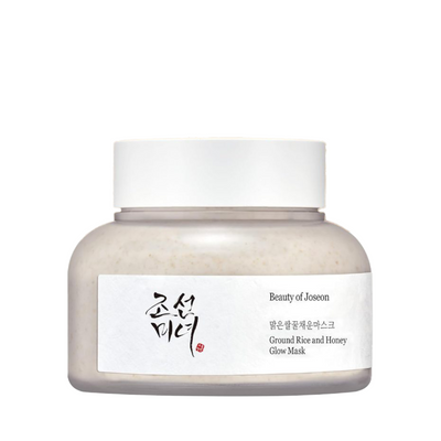 Rund krukke med hvidt låg, mærket "Beauty of Joseon". Tekst: Ground Rice and Honey Glow Mask.