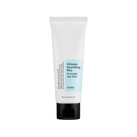 Hvid tube med sort låg, mærket "Ultimate Nourishing Rice Overnight Spa Mask" fra COSRX, 60 ml.