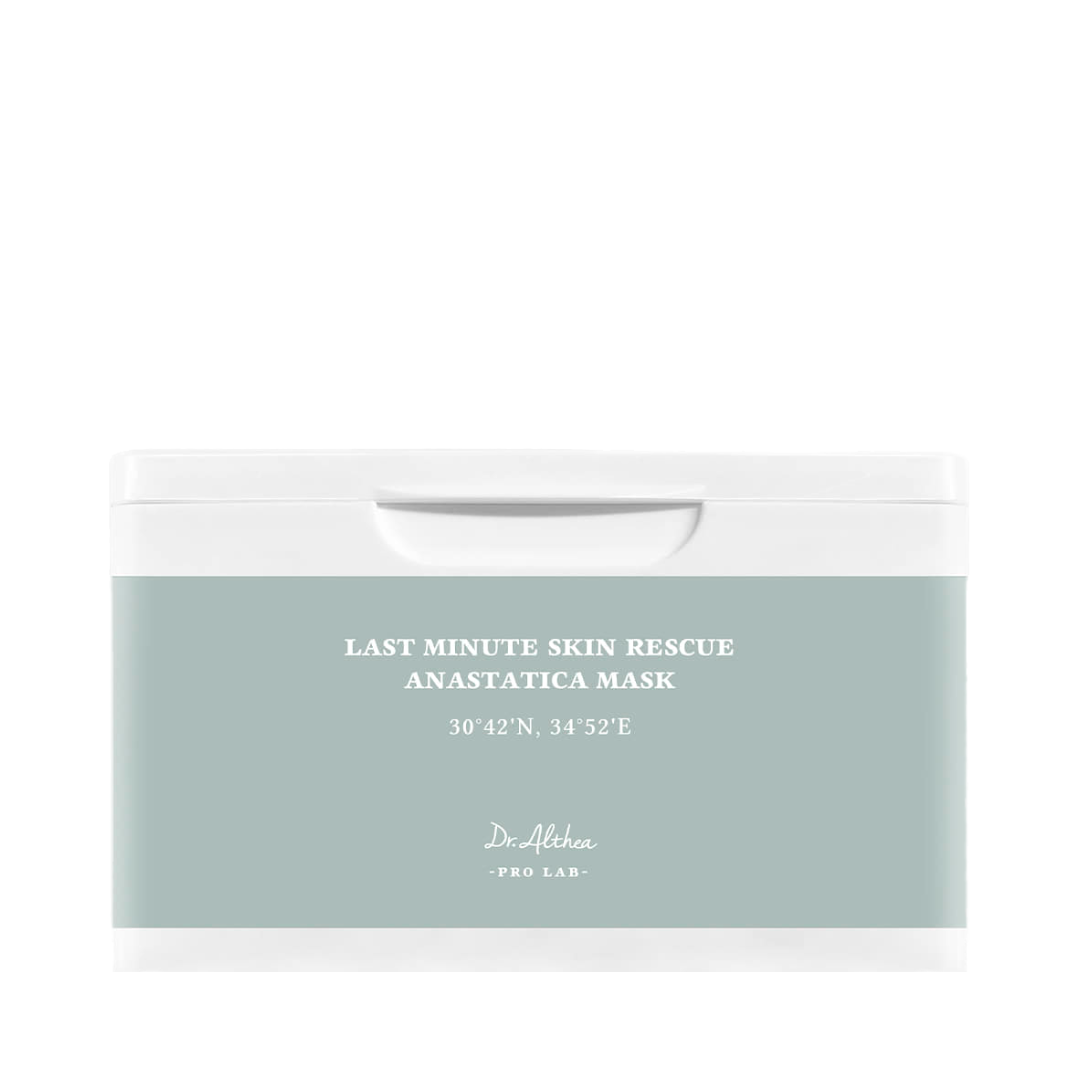 Hvid beholder med lyseblå etiket, tekst: "Last Minute Skin Rescue Anastatica Mask", Dr. Althea.