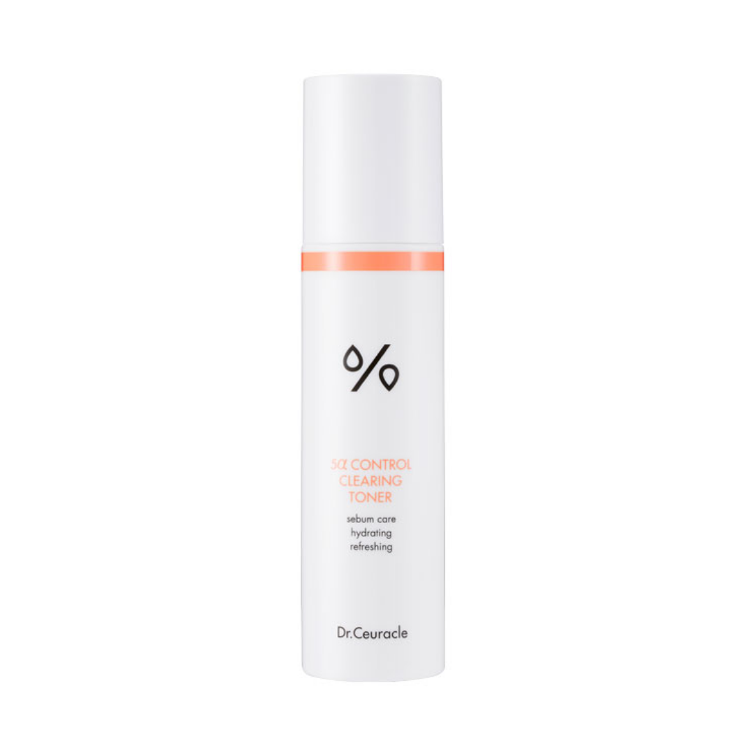 Hvid flaske med orange detaljer, tekst: "5α Control Clearing Toner", mærket Dr. Ceuracle.