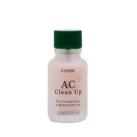 Flaske med grøn hætte og lyserød etiket, mærket "Etude AC Clean Up Pink Powder Spot".