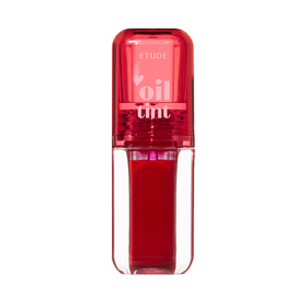 Klar beholder med rød olie tint, rød låg med "ETUDE oil tint" tekst.