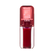 Klar flaske med rød læbefarve og pink låg. Tekst på låget: "oil tint".