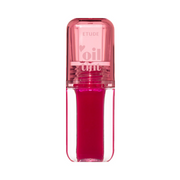 Klar flaske med lyserød hætte og dyb pink væske. Tekst: "Etude oil tint".
