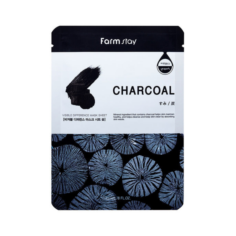Sort maskeemballage med kultekstur, teksten "Farm Stay", "Charcoal" og koreanske tegn.