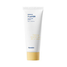 Hvid tube med blå tekst "7 Layer Ceramide Cream," gul hætte. Hanskin-logo nederst.