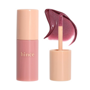 Flaske med "hince" logo. Mauve farve, åben applikator med flydende blush.