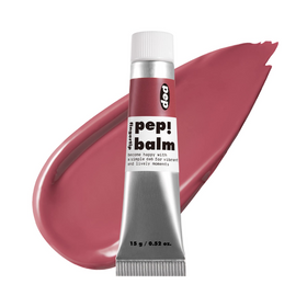 Tuben af I'M MEME Pep! Balm i rosa-rød farve, med farvestribe bagved.