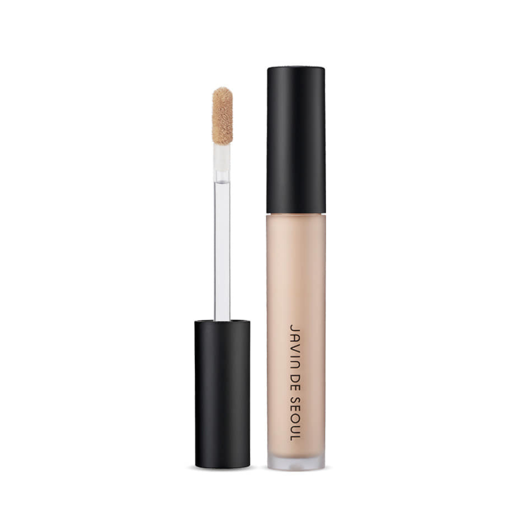 Flydende concealer med applikatorstav og sort låg, mærket "Javin de Seoul". Farve: Cover Vanilla.