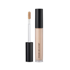Flydende concealer med applikatorstav og sort låg, mærket "Javin de Seoul". Farve: Cover Vanilla.
