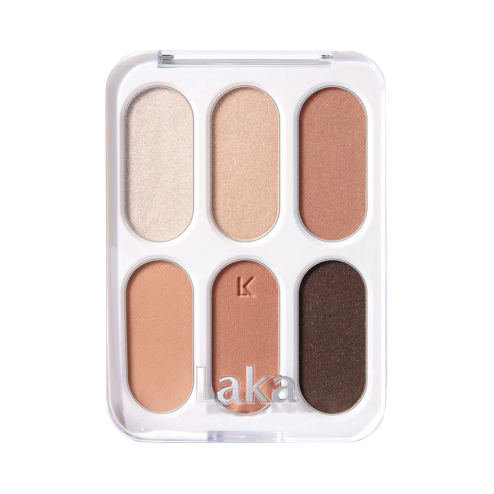 Øjenskyggepalette med seks nuancer fra lys beige til mørk brun.
