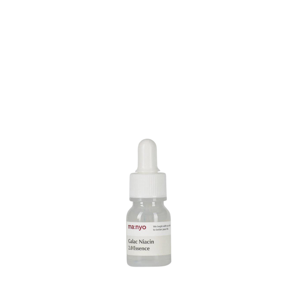 Klar flaske med hvid dråbeprop og etiket: "Manyo Galac Niacin 2.0 Essence".