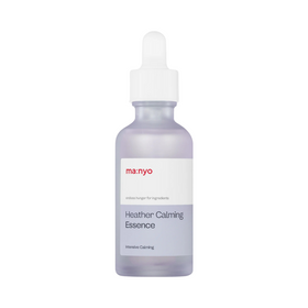 Frostet glasflaske med hvid dråbehætte, mærket "ma:nyo" og "Heather Calming Essence".