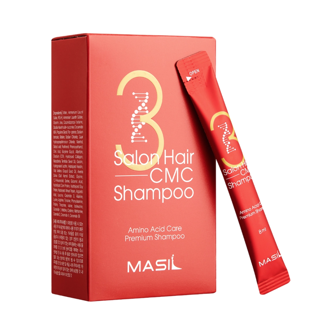 Rød æske og pose med Masil 3 Salon Hair CMC Shampoo. Moderne design med gyldne detaljer.