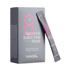 Grå æske med pink tekst "8 Seconds Salon Hair Mask" og "Masil", med en matchende sachet lænet op ad.