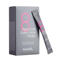 Grå æske med pink tekst "8 Seconds Salon Hair Mask" og "Masil", med en matchende sachet lænet op ad.