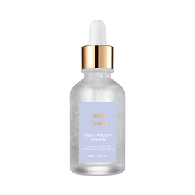 Klar glasflaske med guldhætte, etikette "Milk Touch Glossy Moisture Ampoule", 40ml.