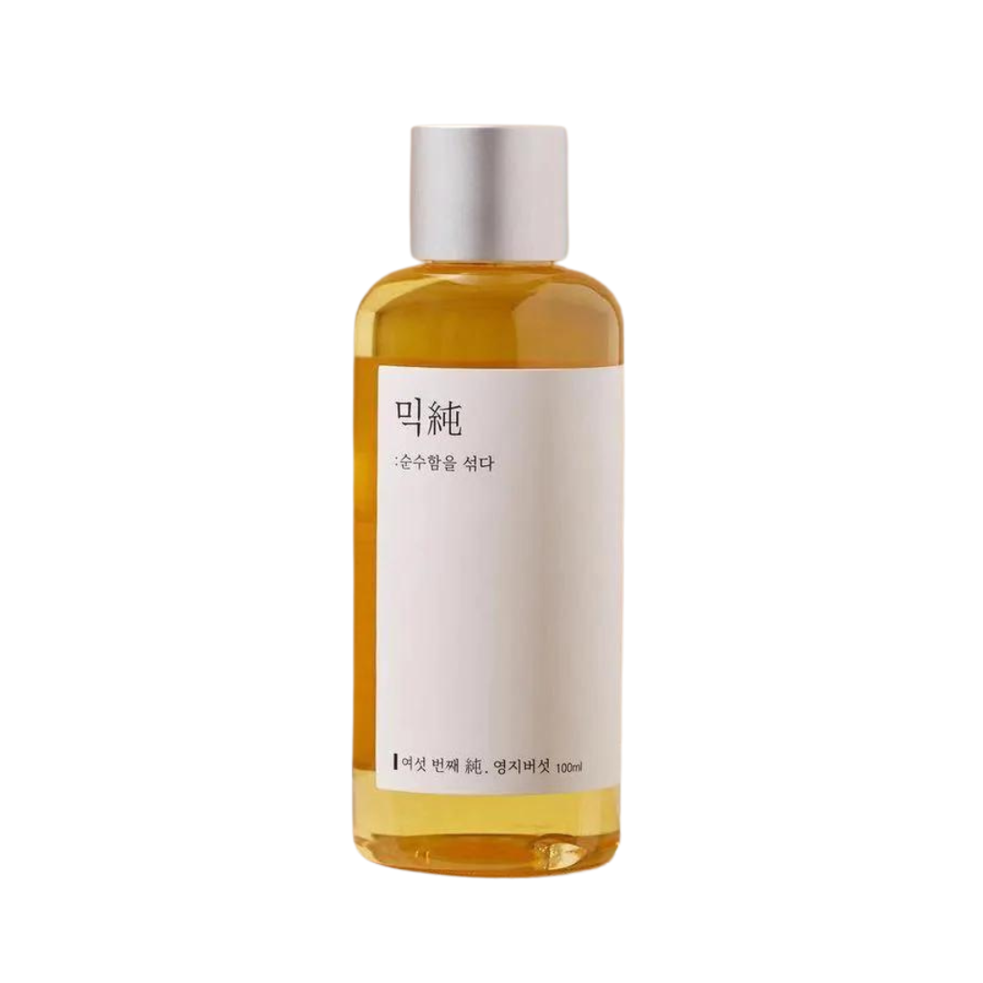 Klar flaske med lysebrun væske, sølvhætte, hvid etiket med koreansk tekst. 100 ml.